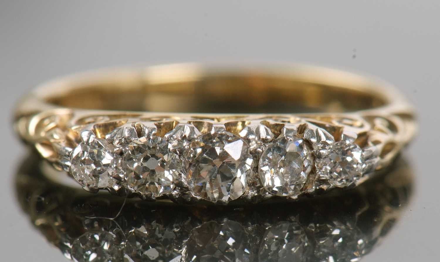 An 18ct five stone diamond ring, the five graduated old round brilliant cut diamonds, set with - Image 4 of 12