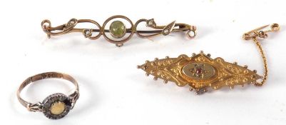 A peridot and seed pearl bar brooch, indistinctly stamped, probably 9ct, 5.5cm long, cased, together
