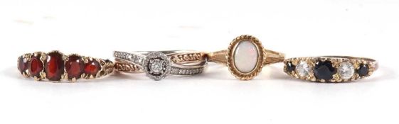 Four gemset rings: to include a 9ct five stone garnet ring, size N-O, 2.5g, a 9ct opal ring, size J,