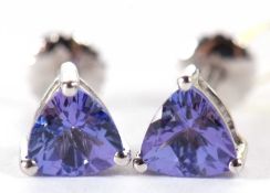 A pair of tanzanite and platinum earrings, the trilliant cut tanzanites, each approx. 5.9mm wide,