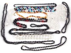 A quantity of bead jewellery to include faceted glass, amber and others