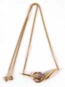 A 14ct gold amethyst and white stone necklace, the central pear shape amethyst collet mounted with