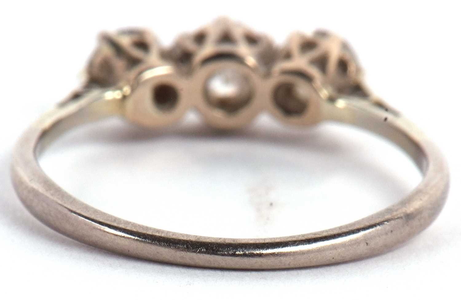 An 18ct white gold three stone diamond ring, the three round brillinat cut diamonds, total estimated - Image 6 of 9