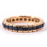 A sapphire eternity ring, the round sapphires all channel set to scalloped band, 3.6mm wide, all