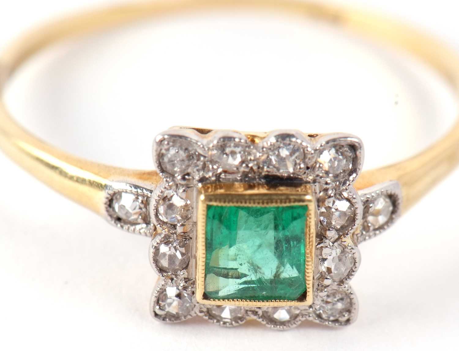 An emerald and diamond ring, the square step cut emerald, collet mounted with a surround of single - Image 11 of 11