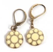 A pair of cream enamel earrings, the round discs decorated with a cream enamel flower, 14mm