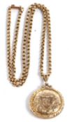 A 9ct locket and chain, the round locket with all over engraved decoration, 2.5cm diameter,