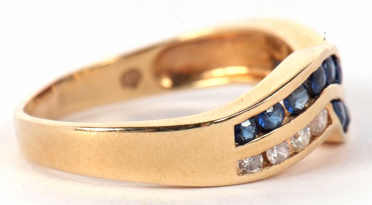 A 14ct sapphire and diamond ring, the two strand crossover style ring set with small round sapphires - Image 6 of 9