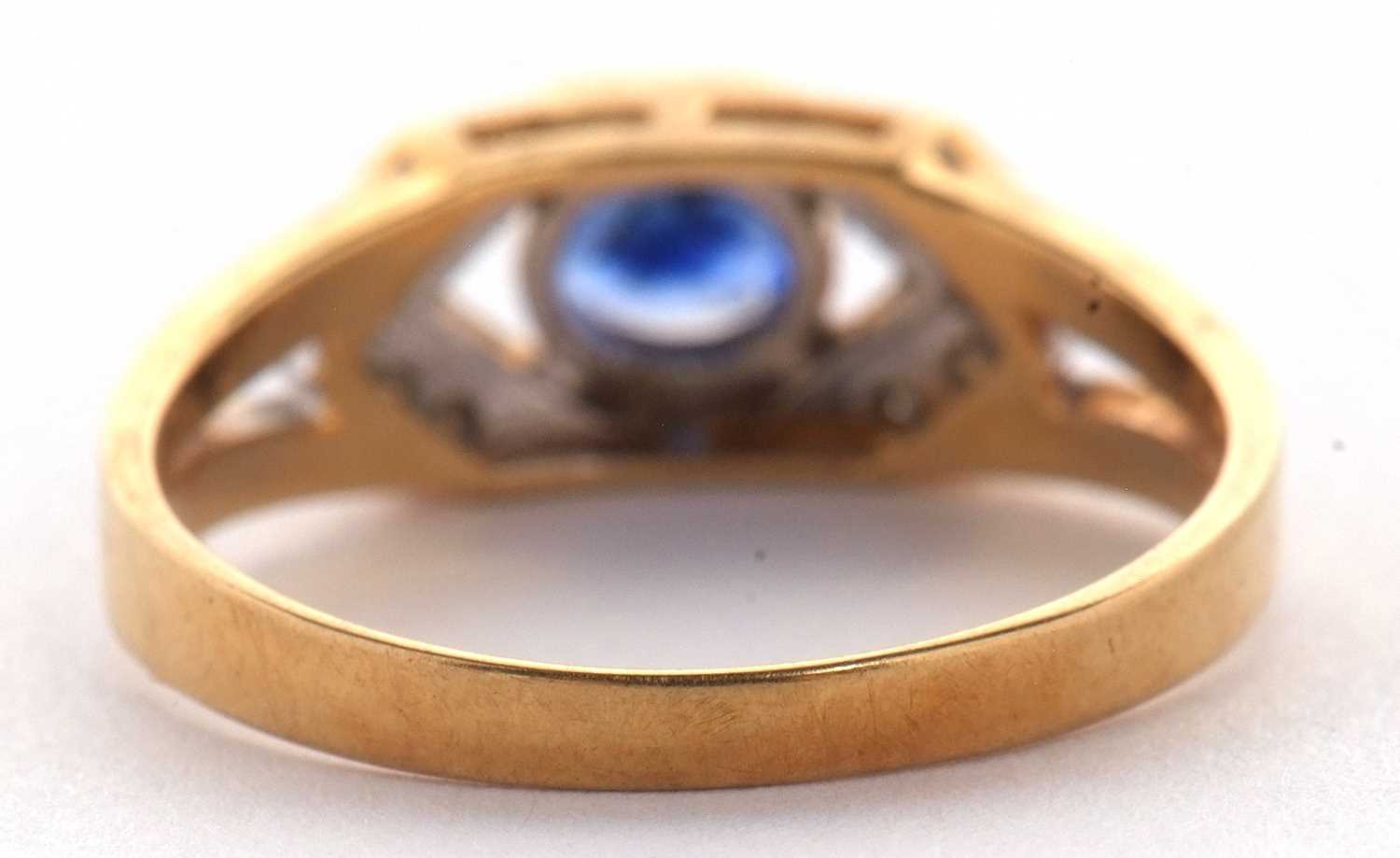 An 18ct sapphire and diamond ring, the central oval sapphire, set to either side with small round - Image 4 of 10