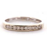 A 9ct half hoop diamond eternity ring, the upper half set with small round diamonds, total 0.