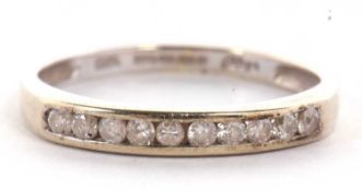 A 9ct half hoop diamond eternity ring, the upper half set with small round diamonds, total 0.