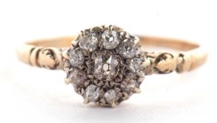 A diamond cluster ring, the cluster comprised of old mine cut diamonds set in white metal, to a