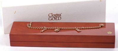 A Welsh 9ct Clogau gold charm bracelet, the fine curblink bracelet with T-bar clasp, with 9ct rose