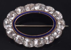 A 19th century white stone and blue enamel brooch, the inner oval blue enamel ring in yellow metal