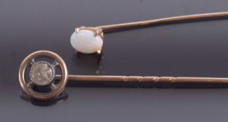 A diamond stick pin and an opal stick pin, the round diamond, estimated approx. 0.33cts, collet
