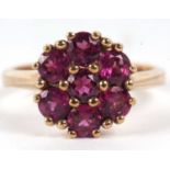 A 9ct cluster ring (possibly rubelite), the cluster comprised of round claw set stones, overall 12mm