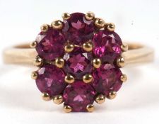 A 9ct cluster ring (possibly rubelite), the cluster comprised of round claw set stones, overall 12mm