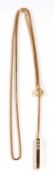 An 18ct diamond lariat necklace, the 2.5cm long gold baton set with small round diamonds, fixed to a