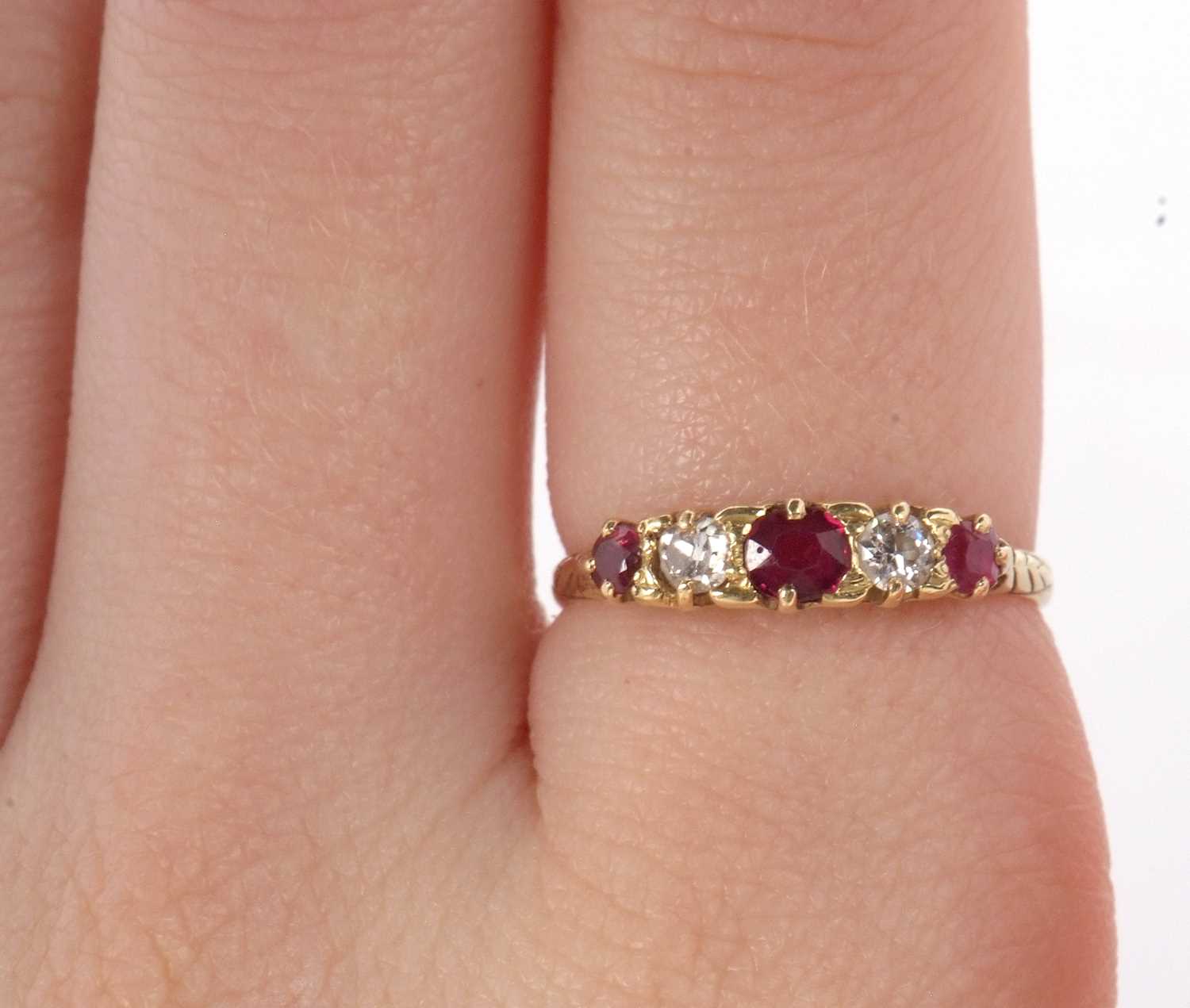 An early 20th century 18ct ruby and diamond ring, the alternating round, graduated rubies and - Image 10 of 10