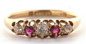 An 18ct ruby and diamond ring, the old mine cut diamonds interspaced with round rubies, all claw