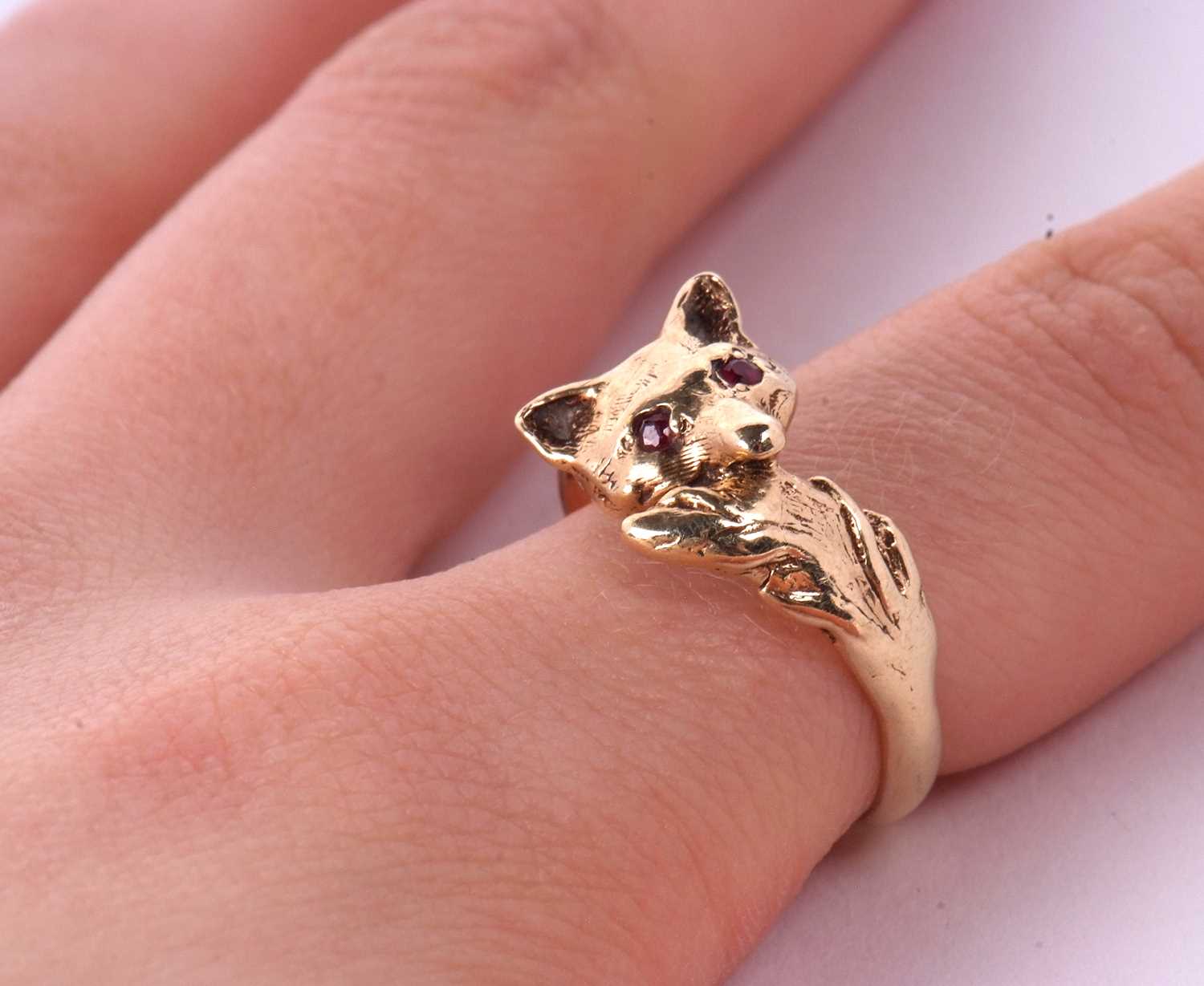 A 9ct fox ring, the fox head set with red hardstone eyes, curling round with tail meeting at other - Image 10 of 10