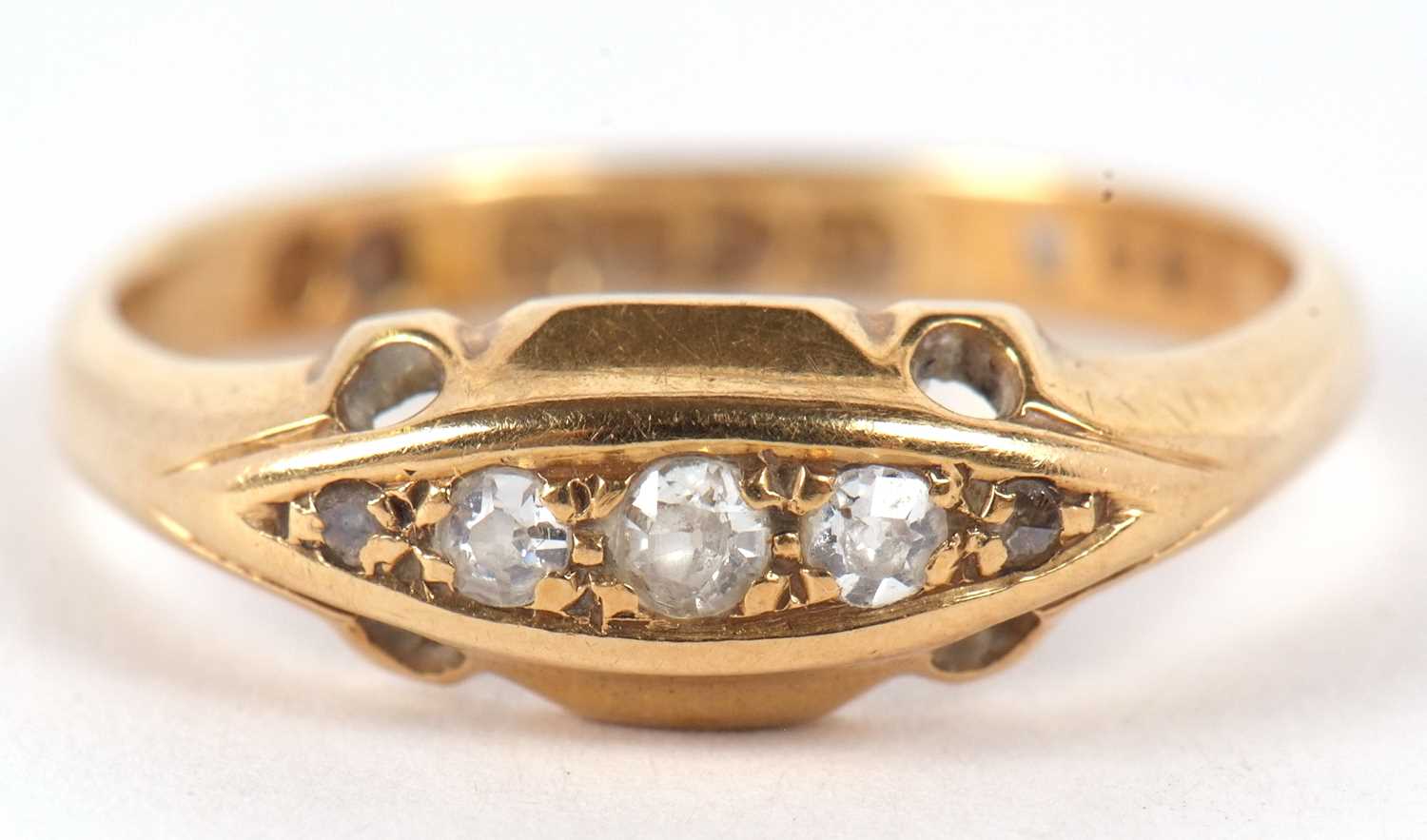 An early 20th century 18ct diamond ring, the three graduated single cut diamonds set to either end - Image 2 of 8