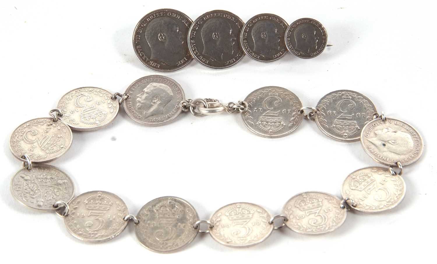 A threepence coin bracelet and a coin brooch, 23g gross