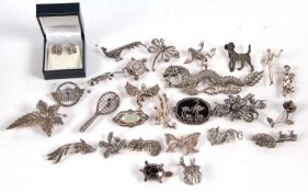 A large silver marcasite dragon brooch, and a quantity of marcasite and silver jewellery
