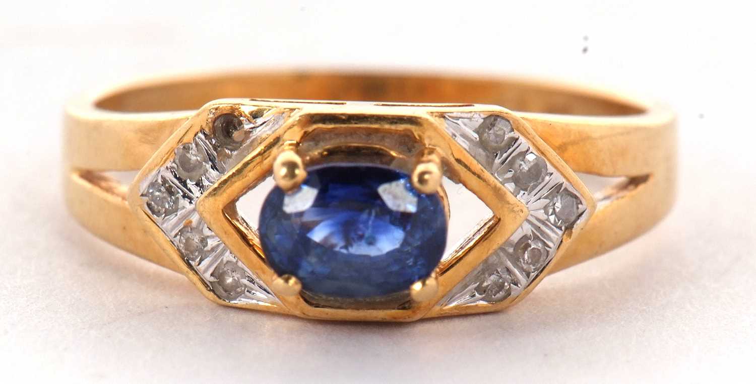 An 18ct sapphire and diamond ring, the central oval sapphire, set to either side with small round - Image 2 of 10
