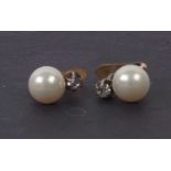 A pair of faux pearl earrings, highlighted with small paste set surmounts and post and clip