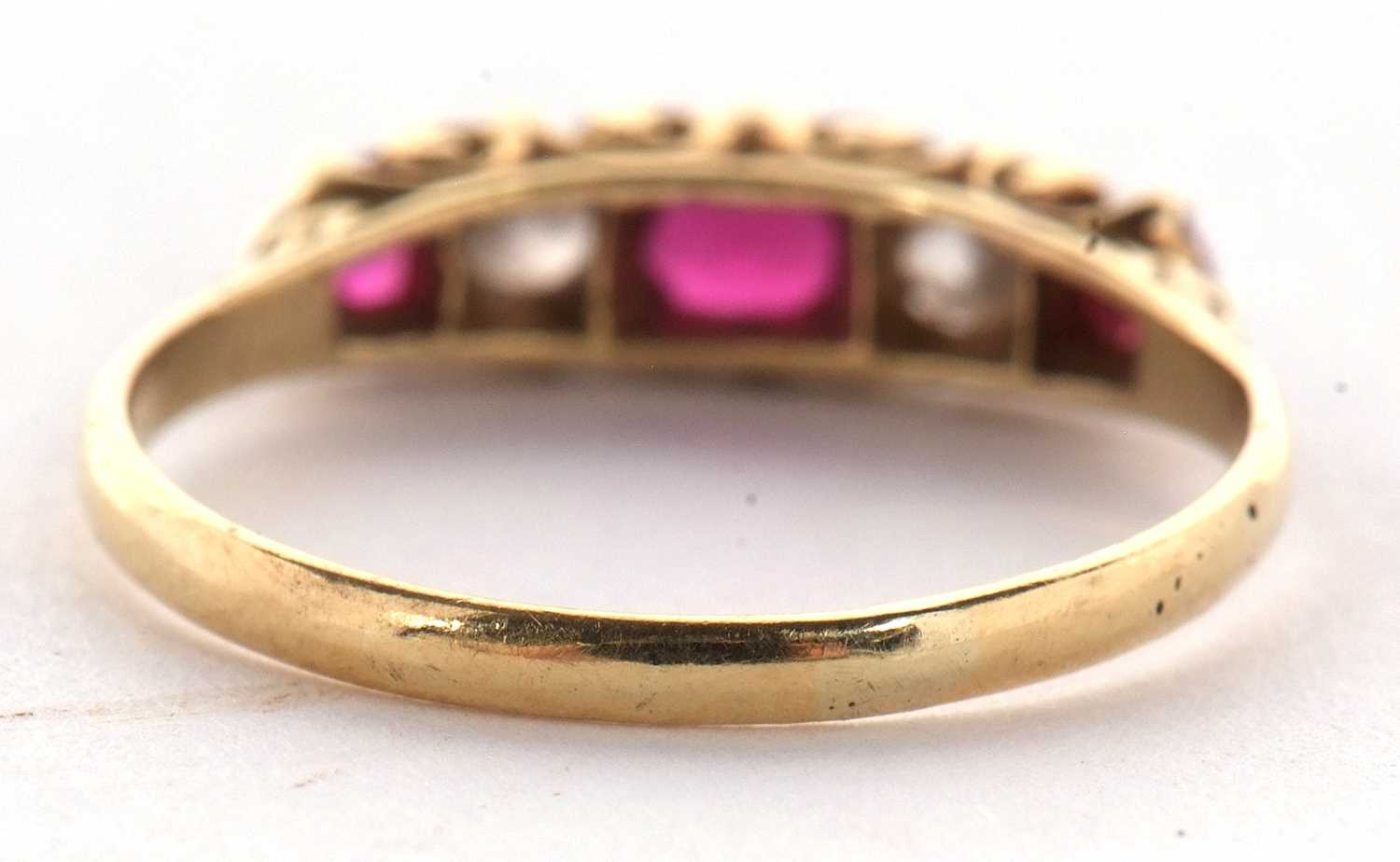 An early 20th century 18ct ruby and diamond ring, the alternating round, graduated rubies and - Image 4 of 10