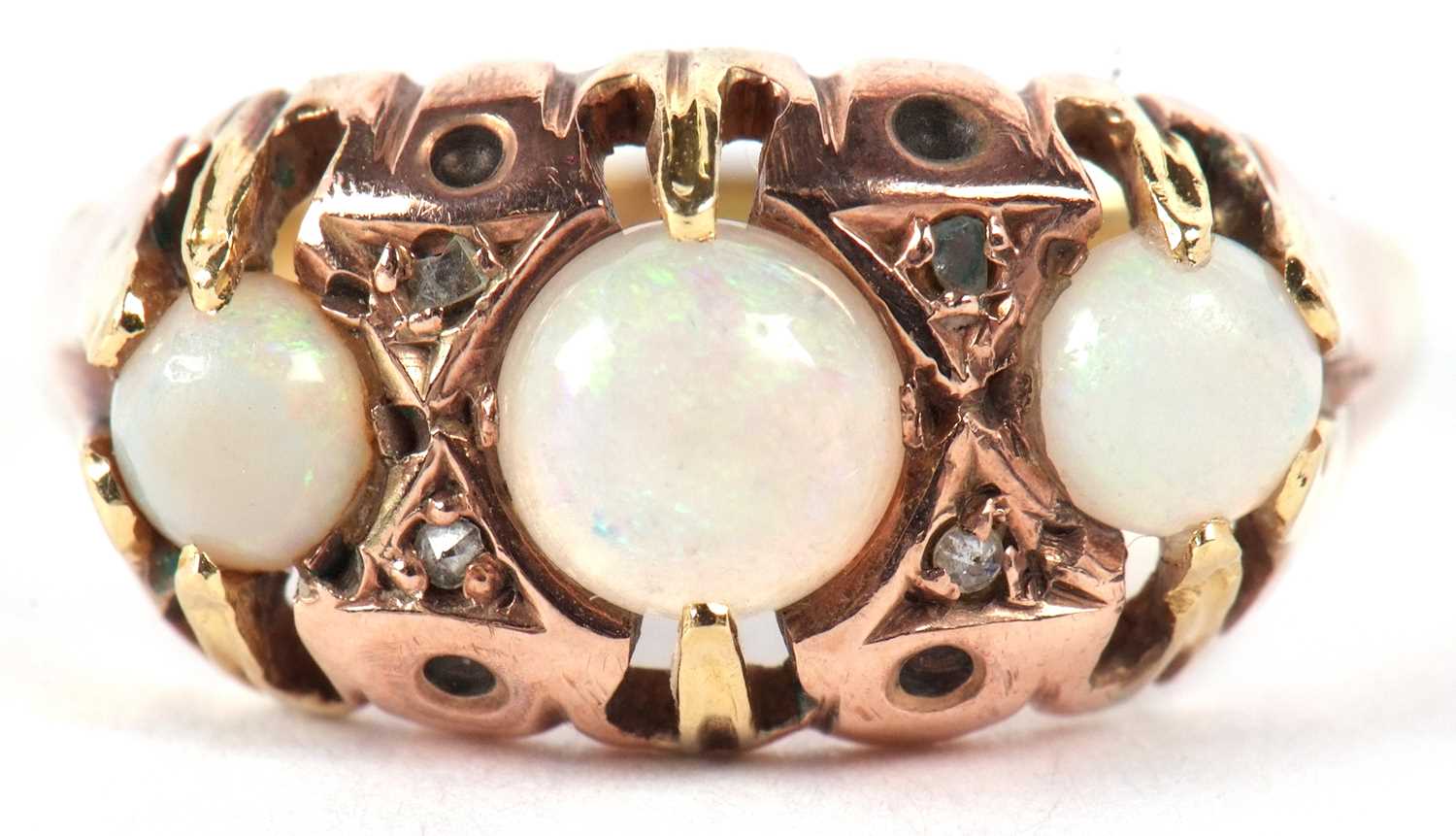 An 18ct three stone opal ring, the three round opal cabochons, set with diamond highlights, with - Image 2 of 9