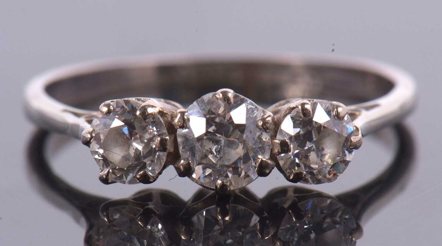 An 18ct white gold three stone diamond ring, the three round brillinat cut diamonds, total estimated - Image 3 of 9