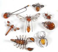 A quantity of amber, silver and white metal insect jewellery to include a dragonfly brooch, 7.5cm