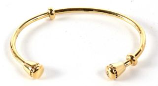 A silver gilt open bangle, with tapered conical ends, stamped 925 with London assay mark, inner