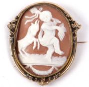 A Victorian cameo shell brooch of oval form depicting a cherub and goat in a gilt metal frame, 5.5 x