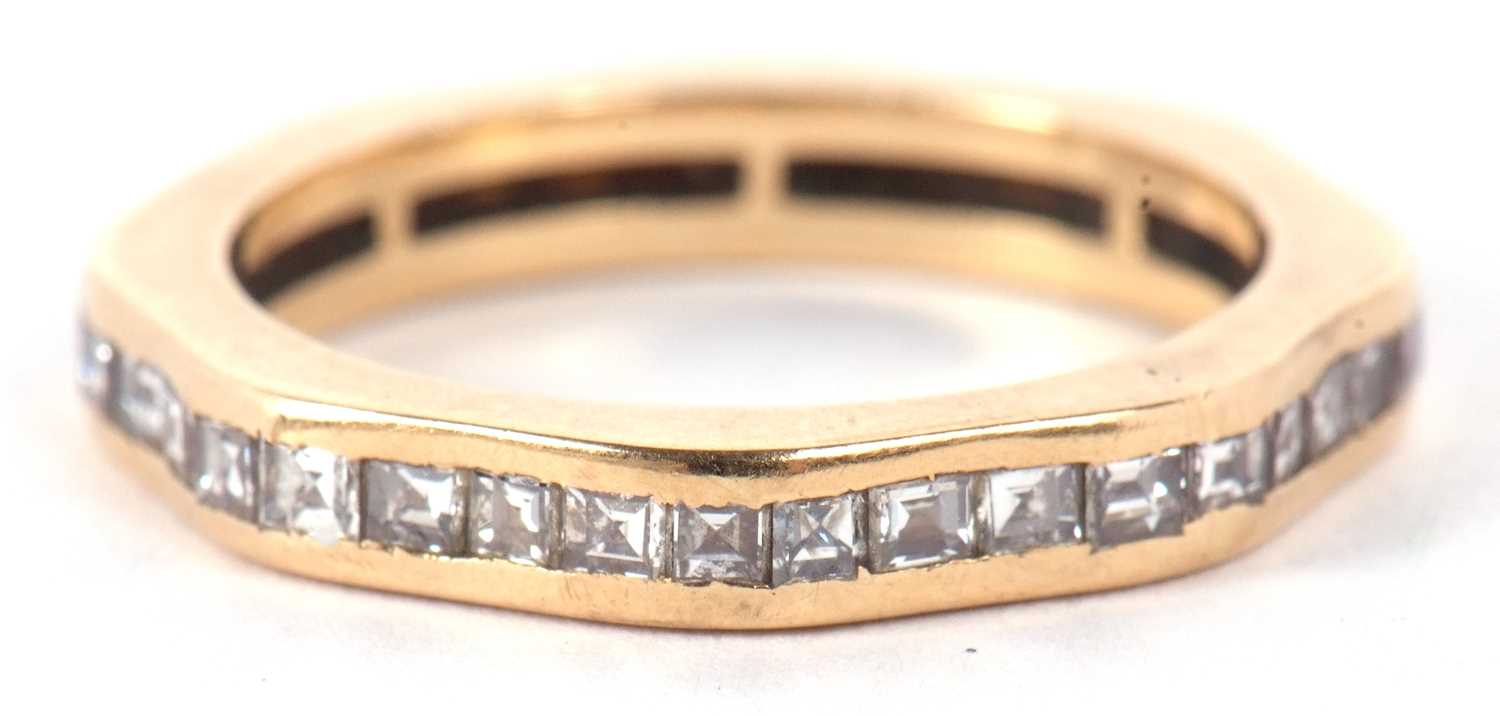 A diamond eternity ring, the full hoop ring set with princess cut diamonds, total estimated