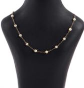 A 9ct cultured pearl necklace, the cultured pearls, each approx. 5mm diameter, separated by fancy