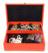 A box of costume jewellery to include a six strand milk glass choker, a gilt metal and green and
