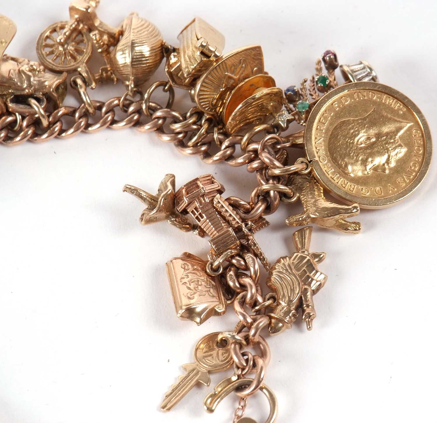 A 9ct charm bracelet, the curblink bracelet, each link stamped 375, with heart shaped padlock clasp, - Image 7 of 10