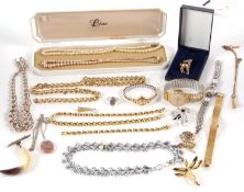 A quantity of mixed costume jewellery to include gilt metal chains, wristwatches, faux pearls, etc