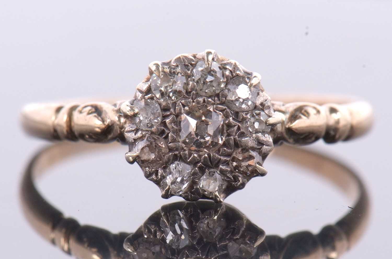 A diamond cluster ring, the cluster comprised of old mine cut diamonds set in white metal, to a - Image 8 of 8