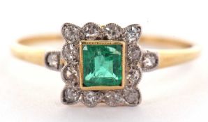 An emerald and diamond ring, the square step cut emerald, collet mounted with a surround of single