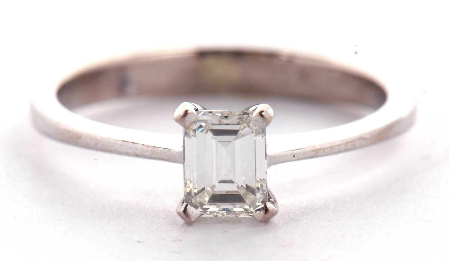 An 18ct white gold diamond solitaire ring, the 0.51ct emerald cut diamond, in a four claw setting to - Image 2 of 9