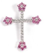 An 18ct white gold diamond and pink stone cross pendant, set with round brilliant cut diamonds and a