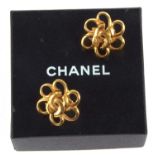 Chanel: a pair of Chanel gilt metal clip earrings, the open flowerhead design set to centre with