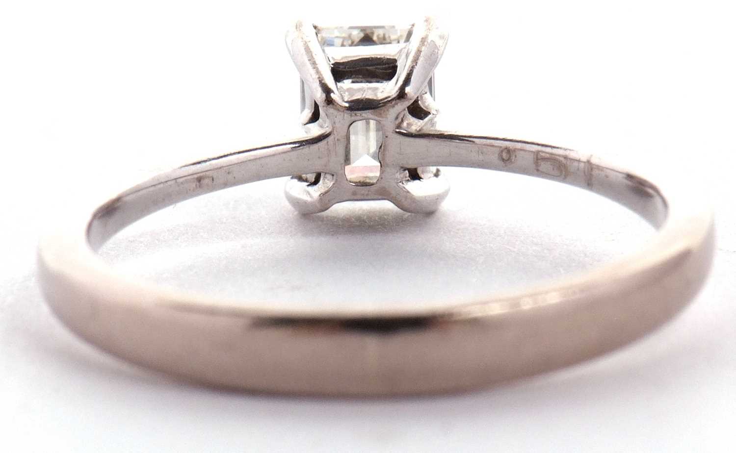 An 18ct white gold diamond solitaire ring, the 0.51ct emerald cut diamond, in a four claw setting to - Image 6 of 9