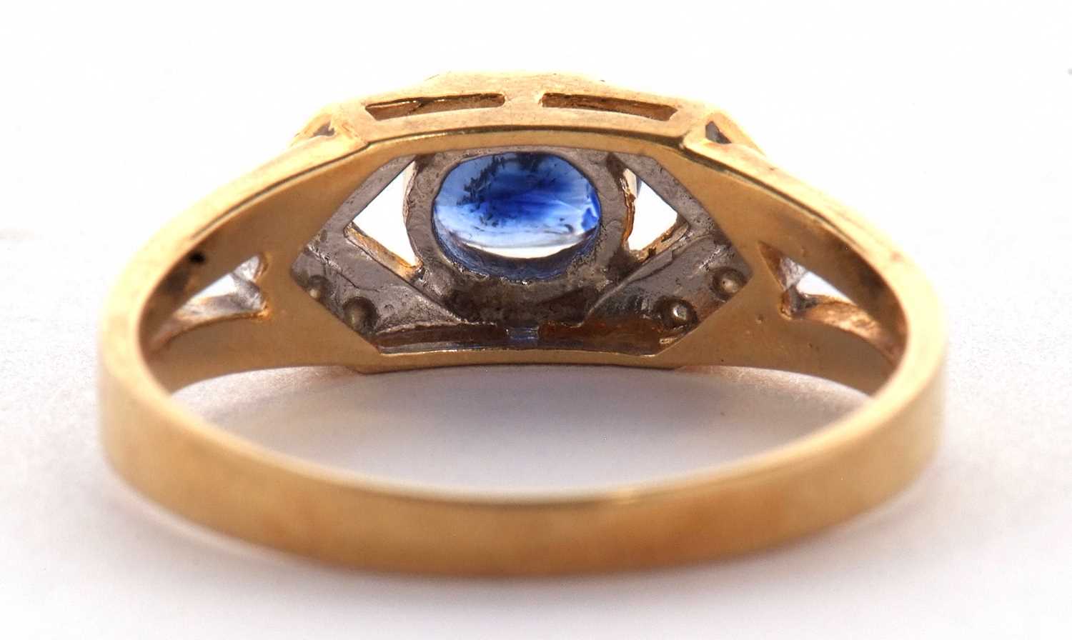 An 18ct sapphire and diamond ring, the central oval sapphire, set to either side with small round - Image 5 of 10
