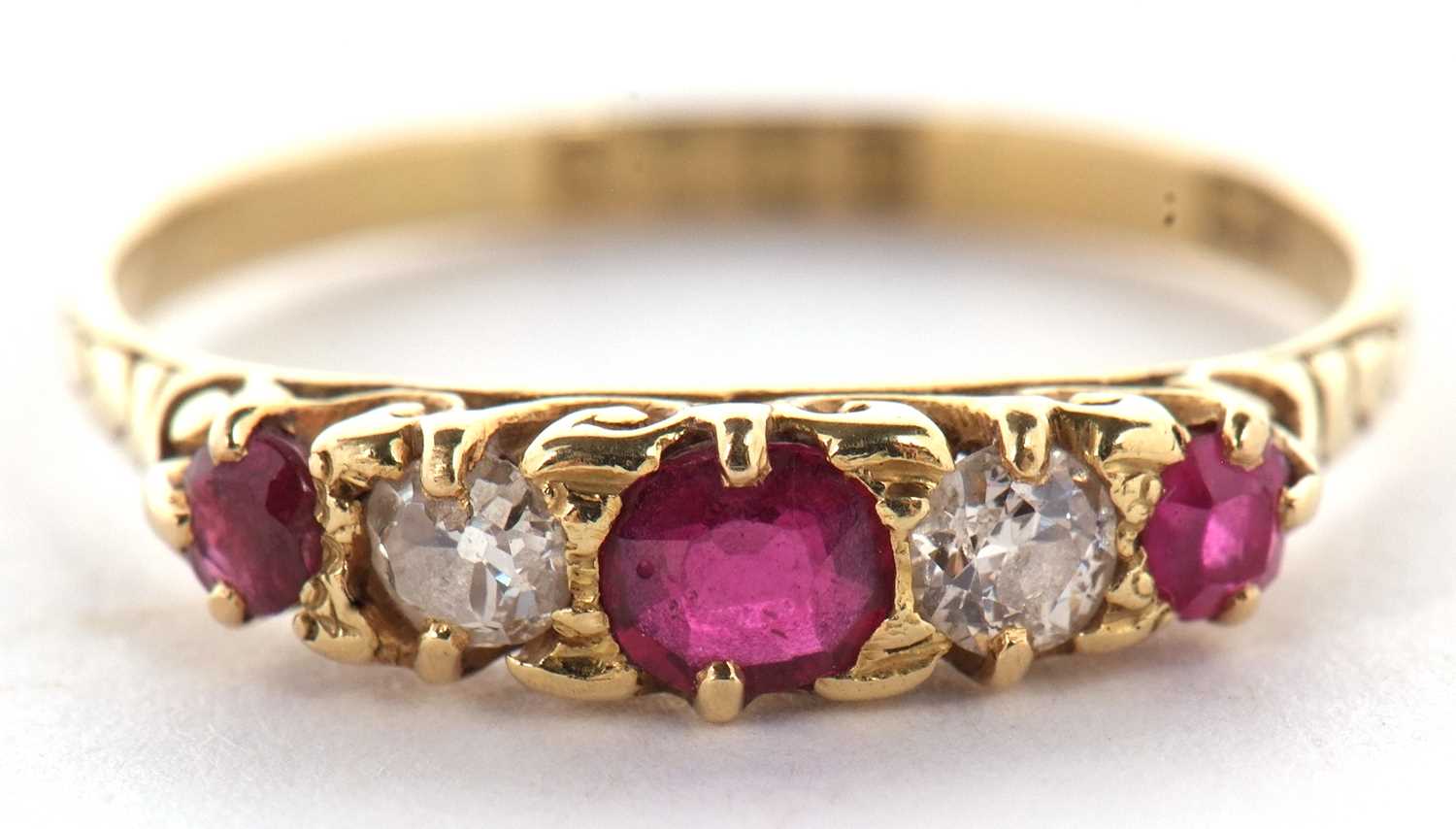 An early 20th century 18ct ruby and diamond ring, the alternating round, graduated rubies and - Image 2 of 10