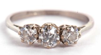 An 18ct white gold three stone diamond ring, the three round brillinat cut diamonds, total estimated